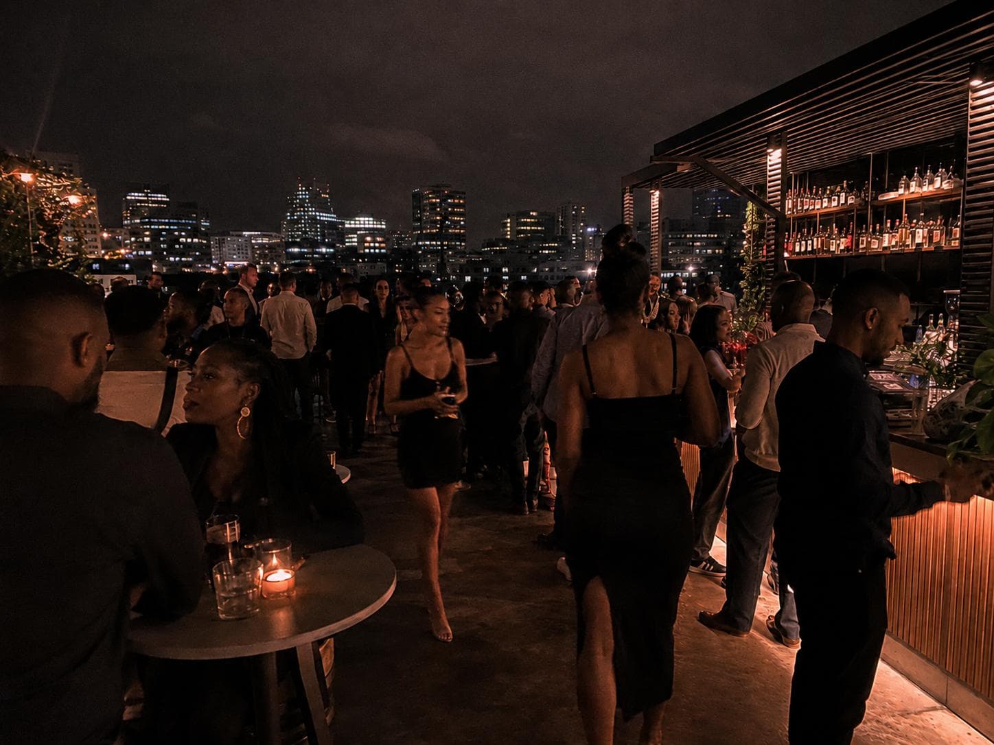 Silq Promotions hostesses working a rooftop event with the Johannesburg skyline at night